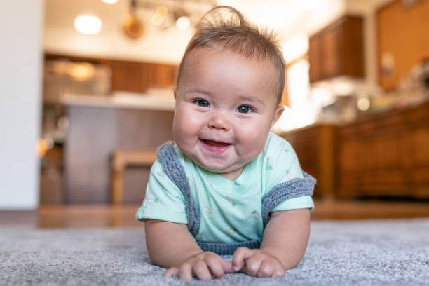 Baby laying on carpet flooring | Bowling Carpet